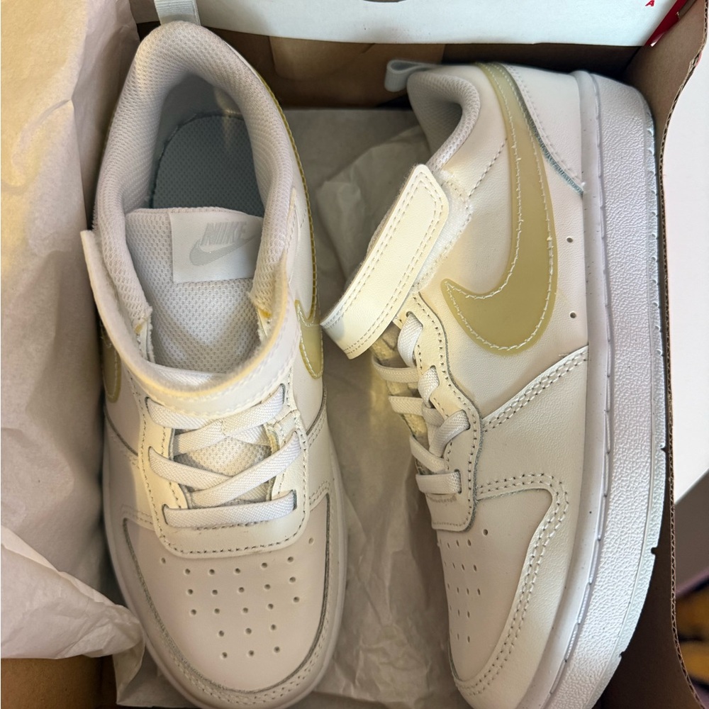 Nike Kids White Sneakers with Gold Highlights